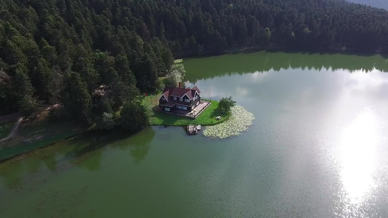 Download Stock Video Aerial View Of A House By The Lake Live Wallpaper for PC
