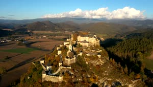 Stock Video Aerial View Of A Medieval Castle In The Mountain Live Wallpaper for PC
