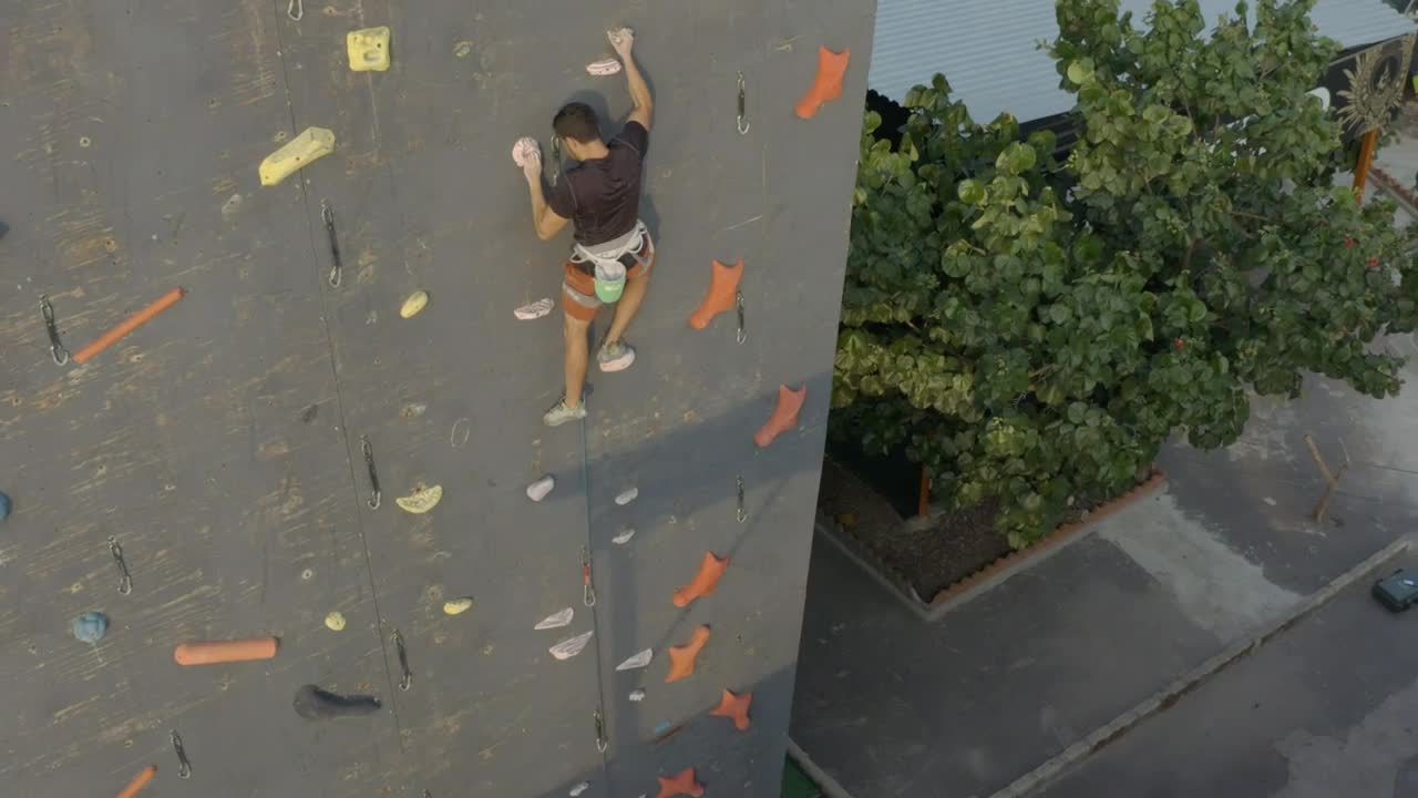 Download Stock Video Aerial View Of A Mountaineer On Top Of A Wall Live Wallpaper for PC