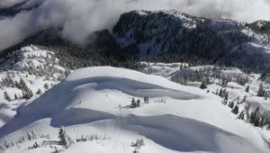 Stock Video Aerial View Of A Mountainous Forest In Winter Live Wallpaper for PC
