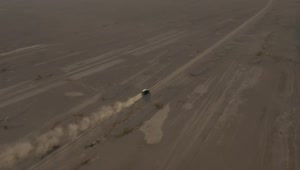Stock Video Aerial View Of A Pickup Truck Traveling Through A Desert Live Wallpaper for PC