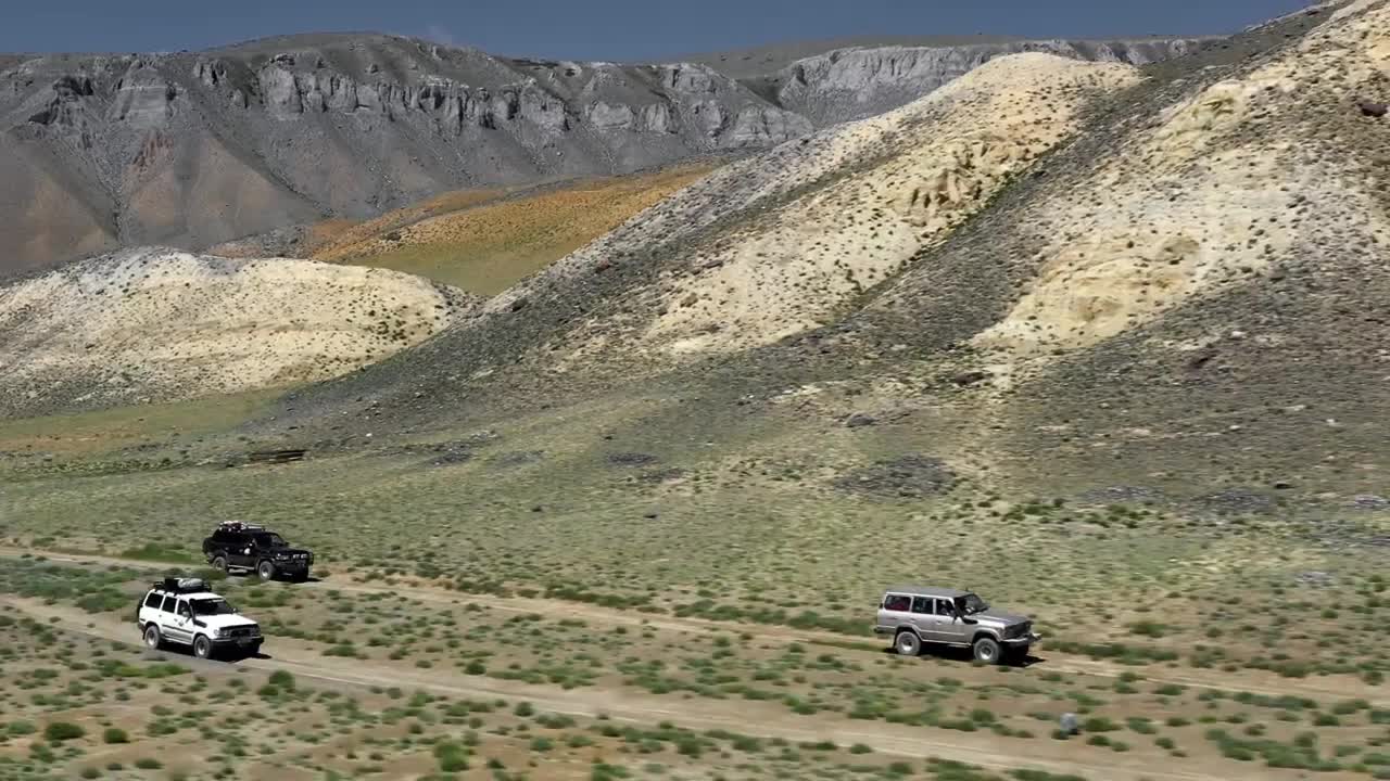 Download Stock Video Aerial View Of A Safari Trip With Off Road Trucks Live Wallpaper for PC