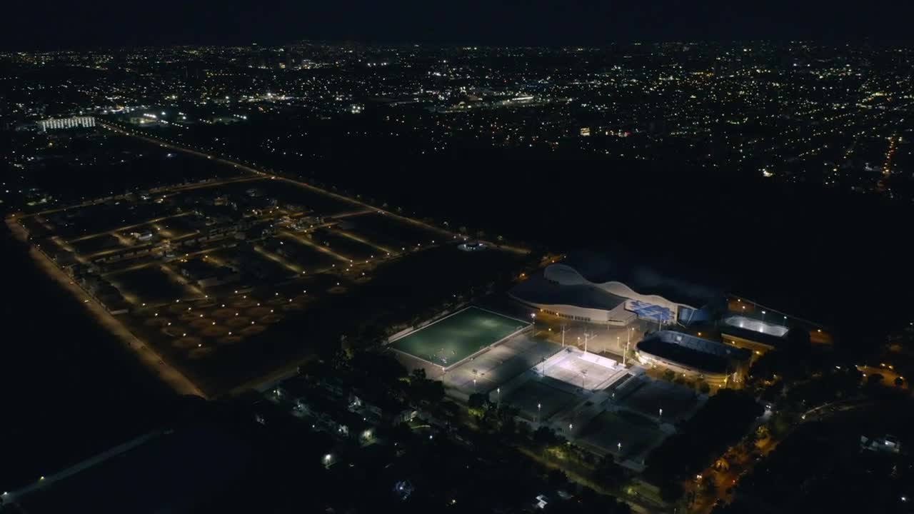 Download Stock Video Aerial View Of A Sports Center At Night Time Live Wallpaper for PC