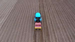 Stock Video Aerial View Of A Tractor Preparing The Soil Live Wallpaper for PC