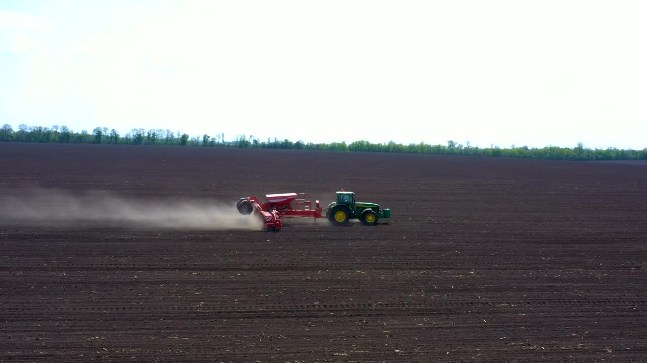 Download Stock Video Aerial View Of A Tractor Working On The Dirt Field Live Wallpaper for PC