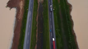 Stock Video Aerial View Of Cars And Trucks Traveling On A Highway Live Wallpaper for PC