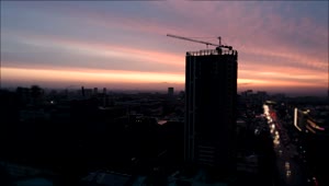 Stock Video Aerial View Of City Construction Crane At Sunset Live Wallpaper for PC