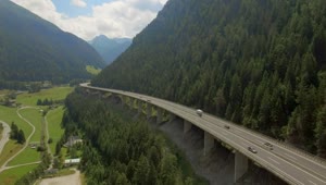 Stock Video Aerial View Of Elevated Highway On Austrian Mountain Valley Live Wallpaper for PC