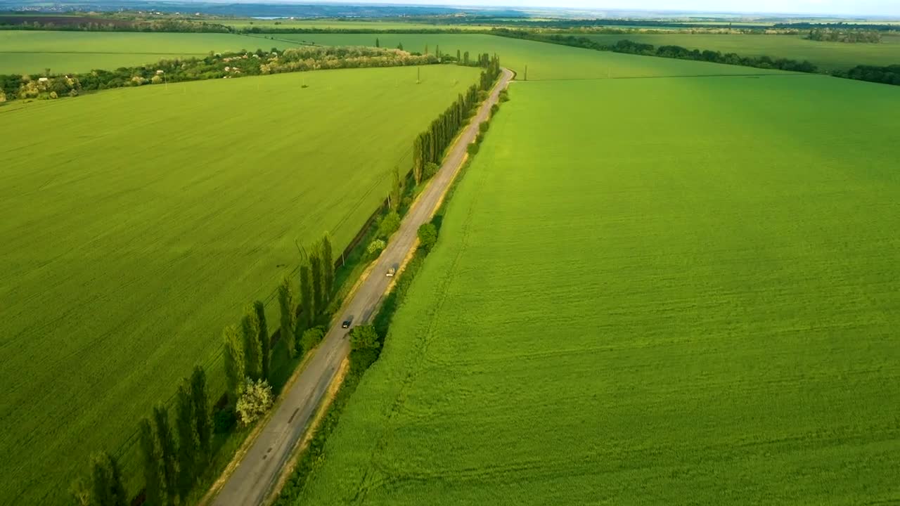 Download Stock Video Aerial View Of Green Fields And A Road Live Wallpaper for PC