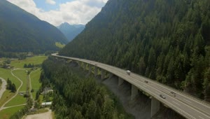 Stock Video Aerial View Of Highway Bridge Along Mountain Ridge Live Wallpaper for PC