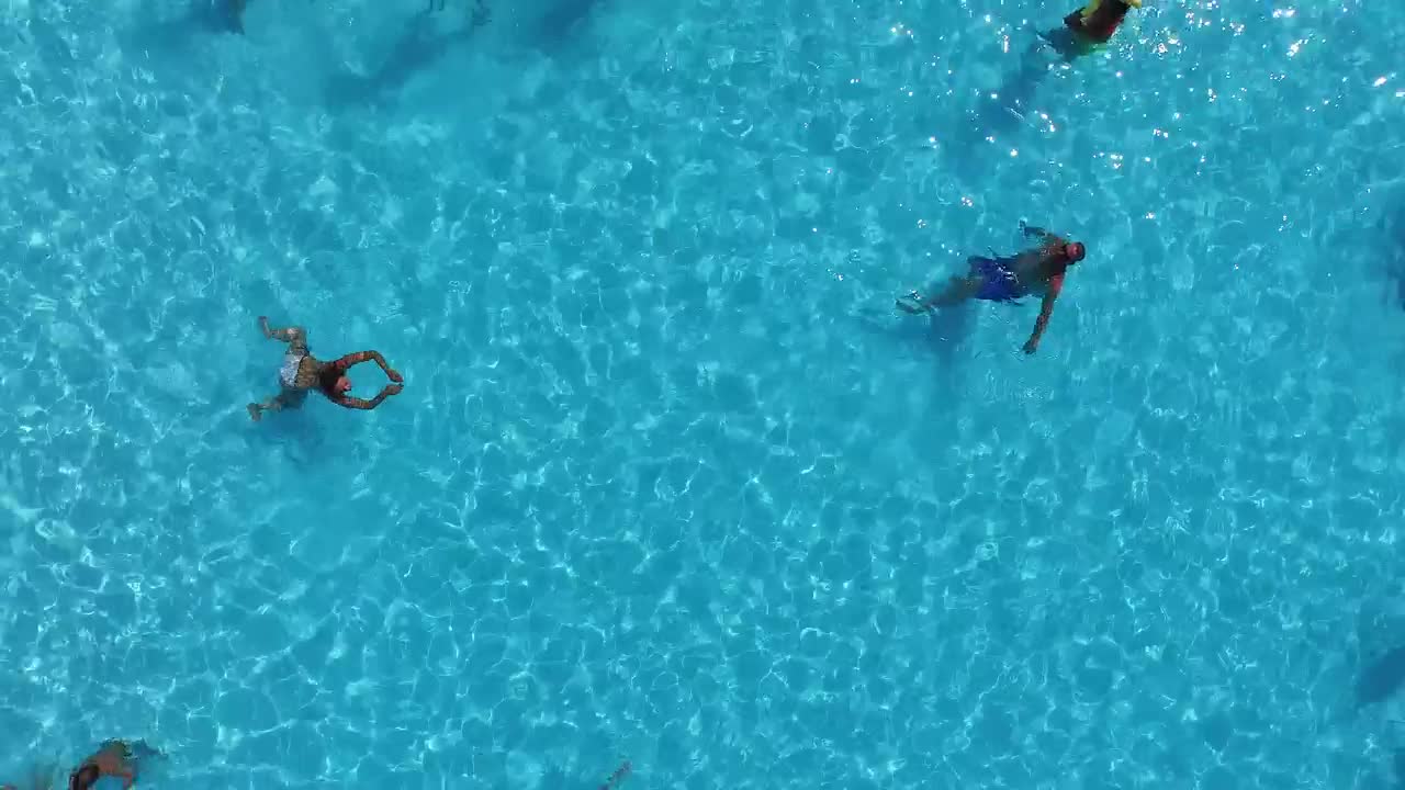 Download Stock Video Aerial View Of People Enjoying The Swimming Pool Live Wallpaper for PC