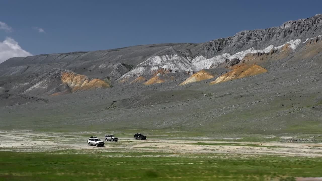 Download Stock Video Aerial View Of Rovers Driving Along Mountains Live Wallpaper for PC