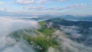 Stock Video Aerial View Of Some Clouds Over A Village Live Wallpaper for PC