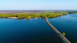 Stock Video Aerial View Of The Dam River With A Road Crossing Live Wallpaper for PC