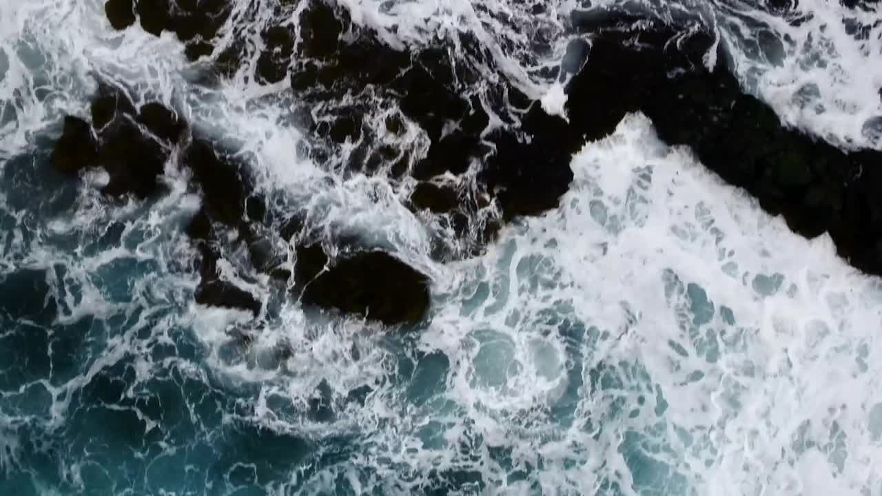 Download Stock Video Aerial View Of The Ocean Crashing On The Shore Live Wallpaper for PC