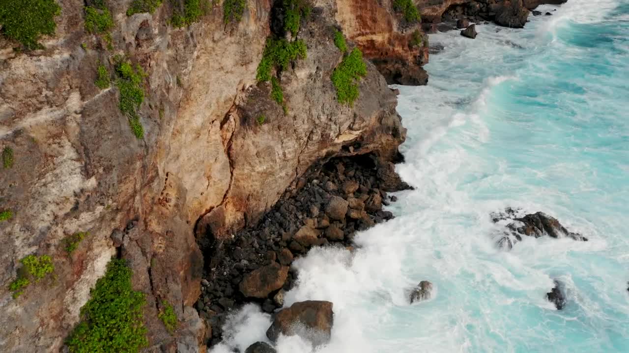 Download Stock Video Aerial View Of Turquoise Waves Crashing On Cliffs Live Wallpaper for PC