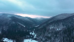 Stock Video Aerial View Of Winter Forested Mountain Landscape Live Wallpaper for PC