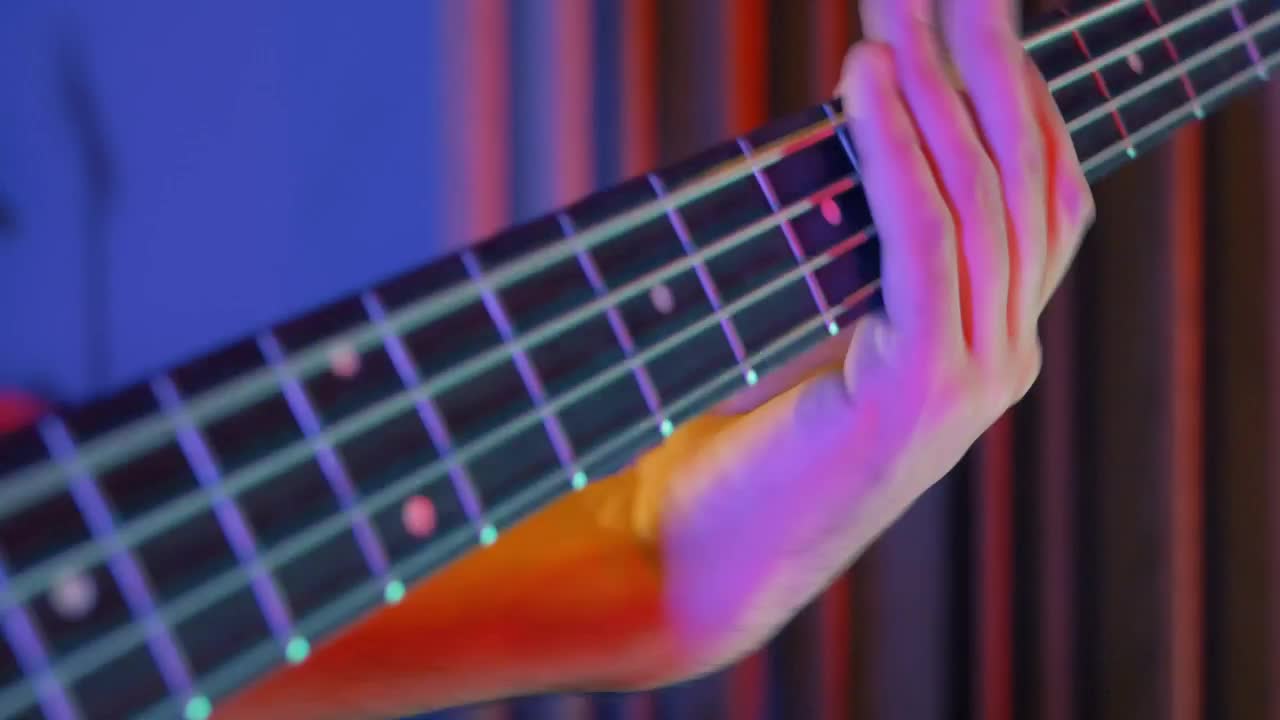 Download Stock Video Bass Player Playing A Song Close Up View Live Wallpaper For PC