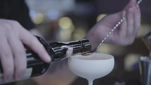 Stock Video Bartender Measures Cherry Liquor Into Spoon Live Wallpaper For PC