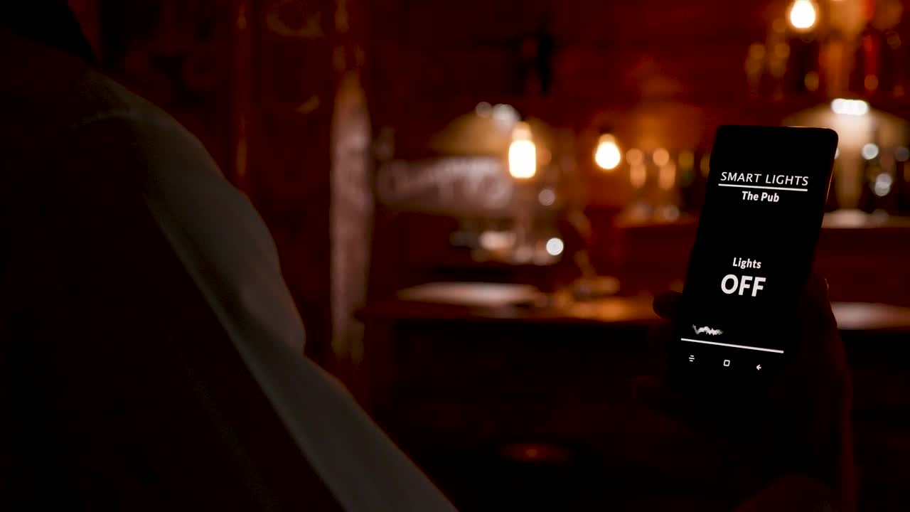 Download Stock Video Barista Uses Mobile App Innovation To Turn On Cafe Lights Live Wallpaper For PC