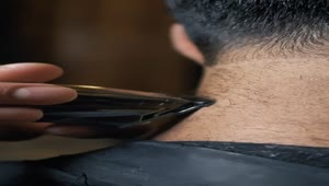 Stock Video Barber Passing The Cutting Machine Over The Neck Of A Live Wallpaper For PC