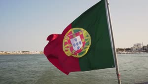 Stock Video Bandera De Portugal Ondeando En El Mar Con La Costa Live Wallpaper For PC