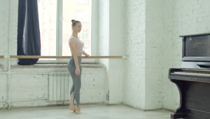 Stock Video Ballet Dancer Warming Up Holding A Pole Live Wallpaper For PC