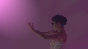 Stock Video Ballet Dancer Moving Her Hands Under A Dim Pink Light Live Wallpaper For PC
