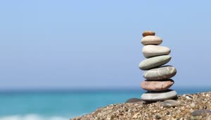 Stock Video Balanced Stones On The Edge Of A Sunny Beach Live Wallpaper For PC