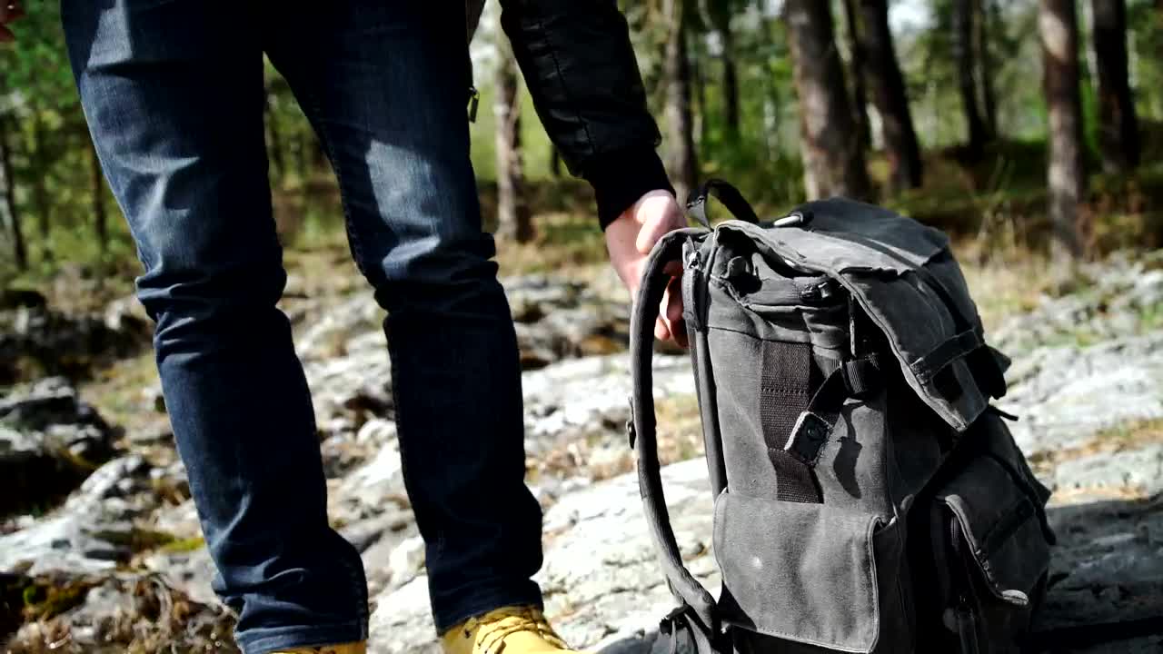 Download Stock Video Backpacker Walks Across Rocky Forest Towards River Live Wallpaper For PC
