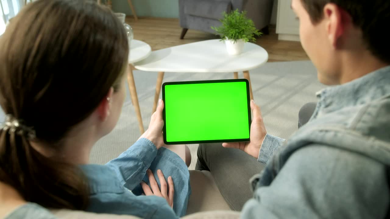 Download Stock Video Back View Of Couple Holding Green Screen Tablet Live Wallpaper For PC