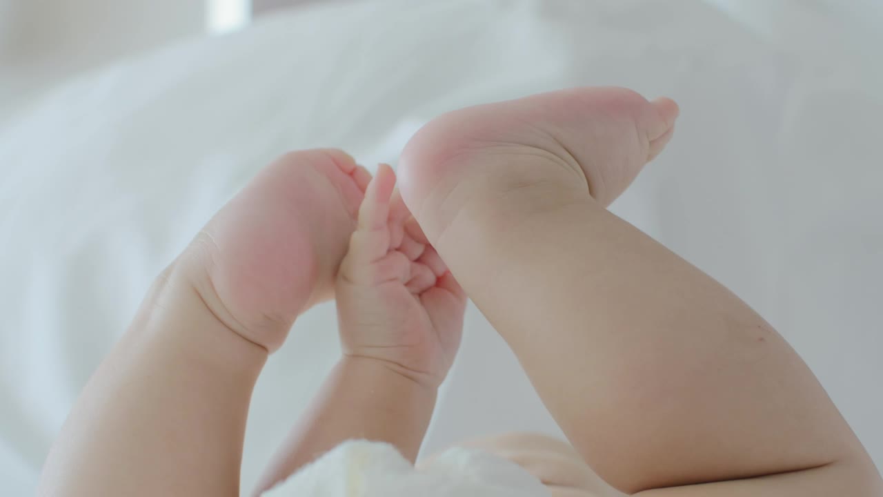 Download Stock Video Baby Playing With Their Feet Live Wallpaper For PC