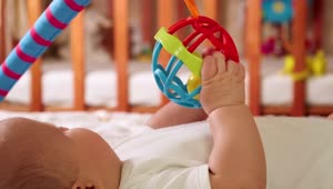 Stock Video Baby Playing With A Toy In His Crib Live Wallpaper For PC