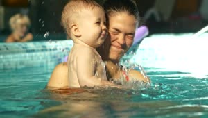 Stock Video Baby Playing In The Pool In His Moms Arms Live Wallpaper For PC