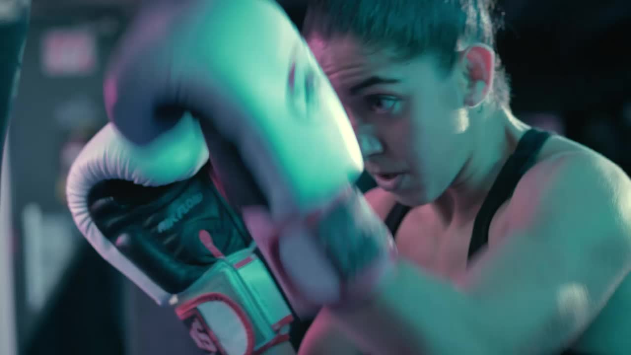 Download Stock Video Athletic Woman Training With A Punching Bag Live Wallpaper For PC