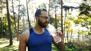 Stock Video Athlete Man Drinking Water During His Training Live Wallpaper For PC