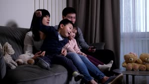 Stock Video Asian Family Enjoying A Tv Show Live Wallpaper For PC