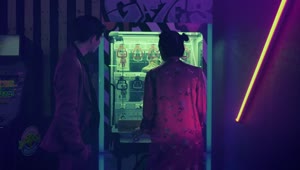 Stock Video Asian Couple Playing With An Arcade Toy Machine Live Wallpaper For PC