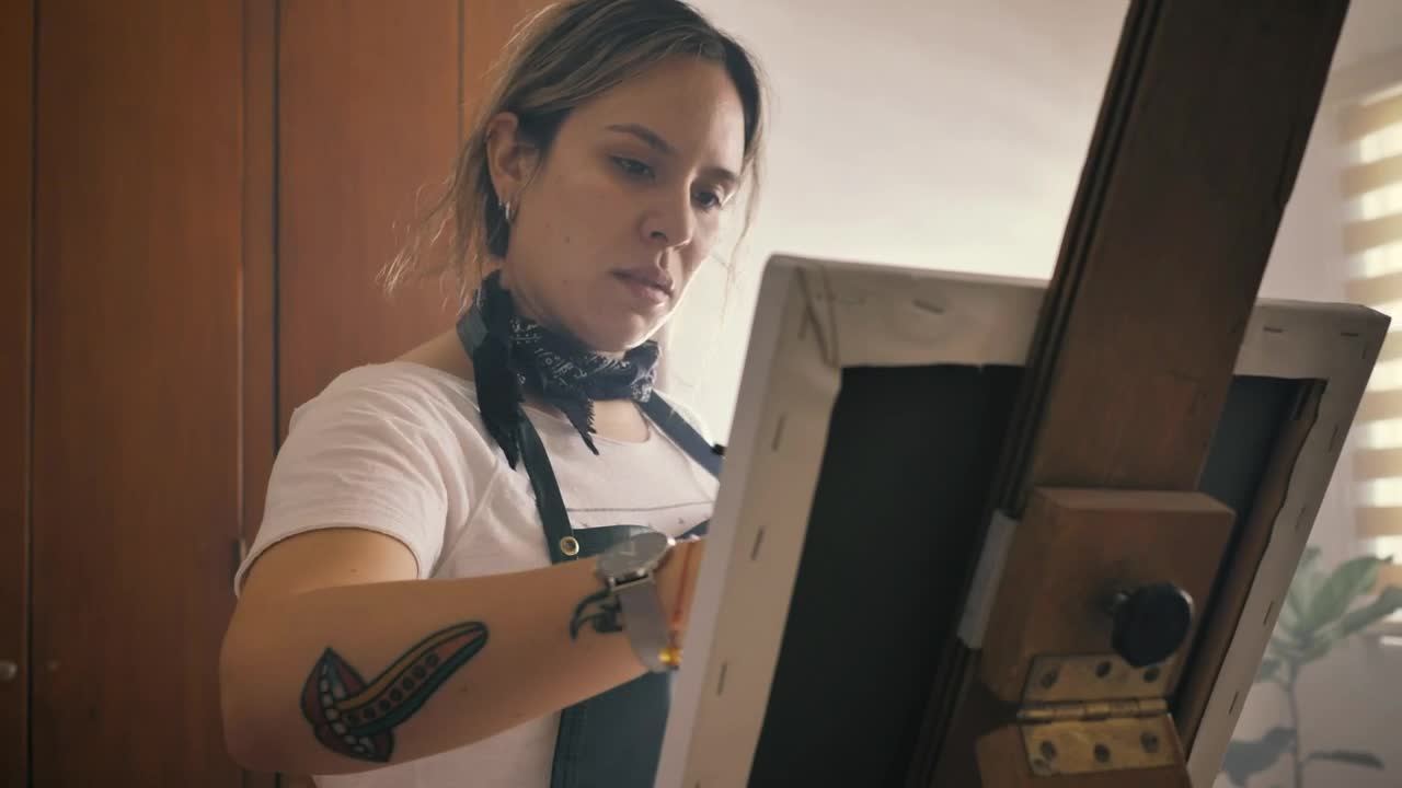 Download Stock Video Artist Working On A Painting On An Easel Live Wallpaper For PC