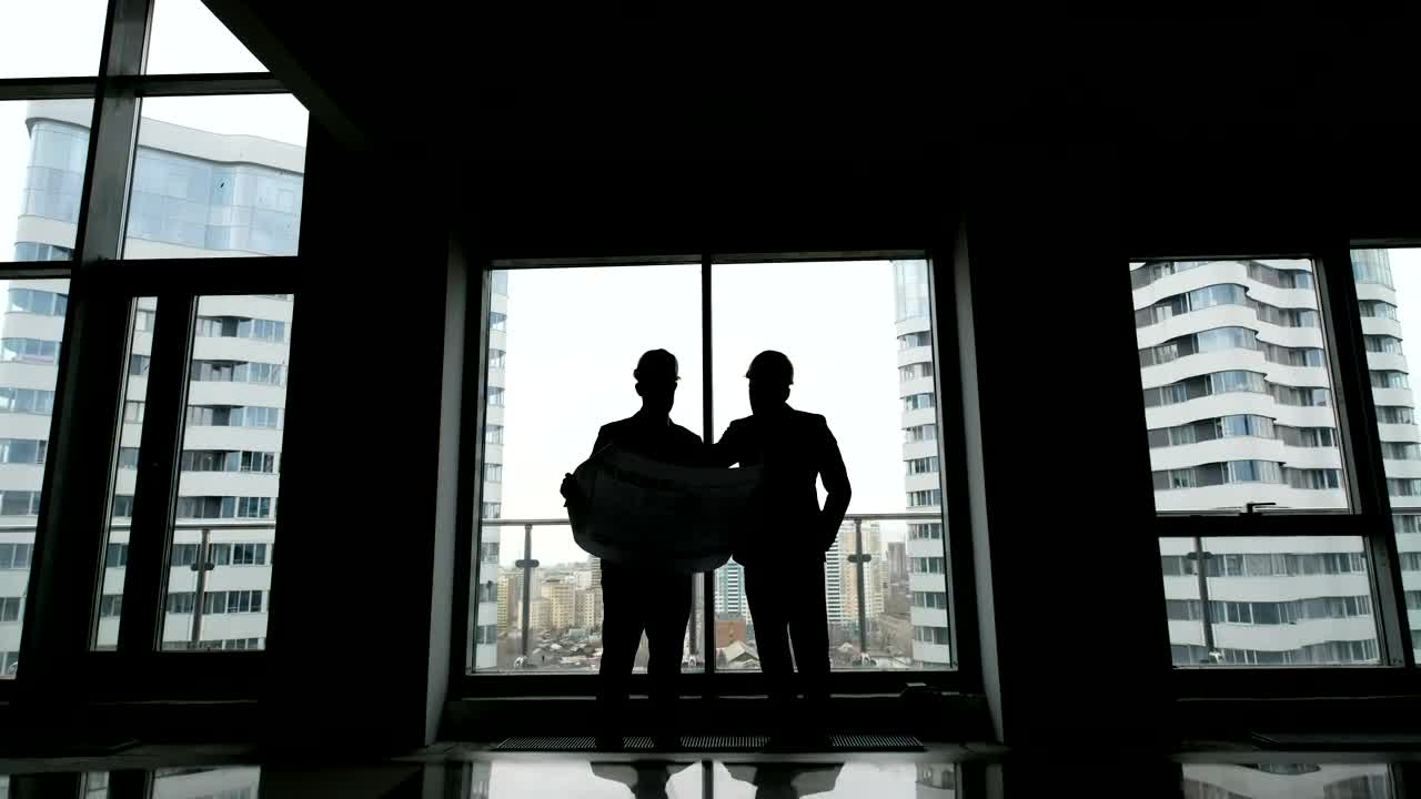 Download Stock Video Architects Checking A Blueprint On A Building Live Wallpaper For PC