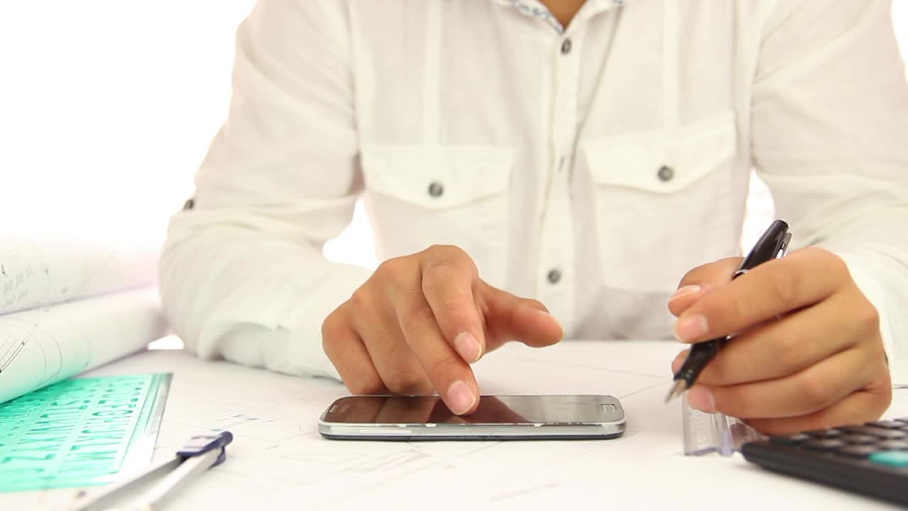 Download Stock Video Architect Using His Smartphone While Working Live Wallpaper For PC