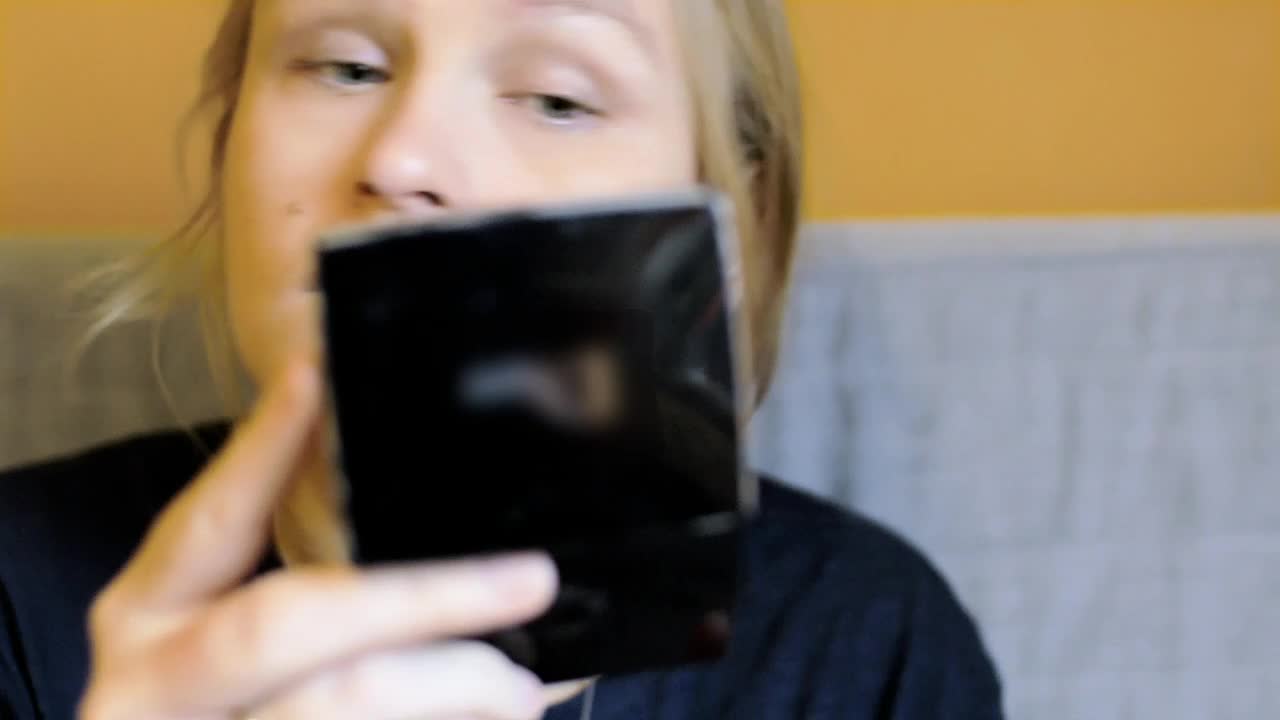 Download Stock Video Applying Makeup Using A Small Mirror Live Wallpaper For PC