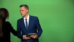 Stock Video Applying Make Up To Newscaster On A Green Screen Live Wallpaper For PC