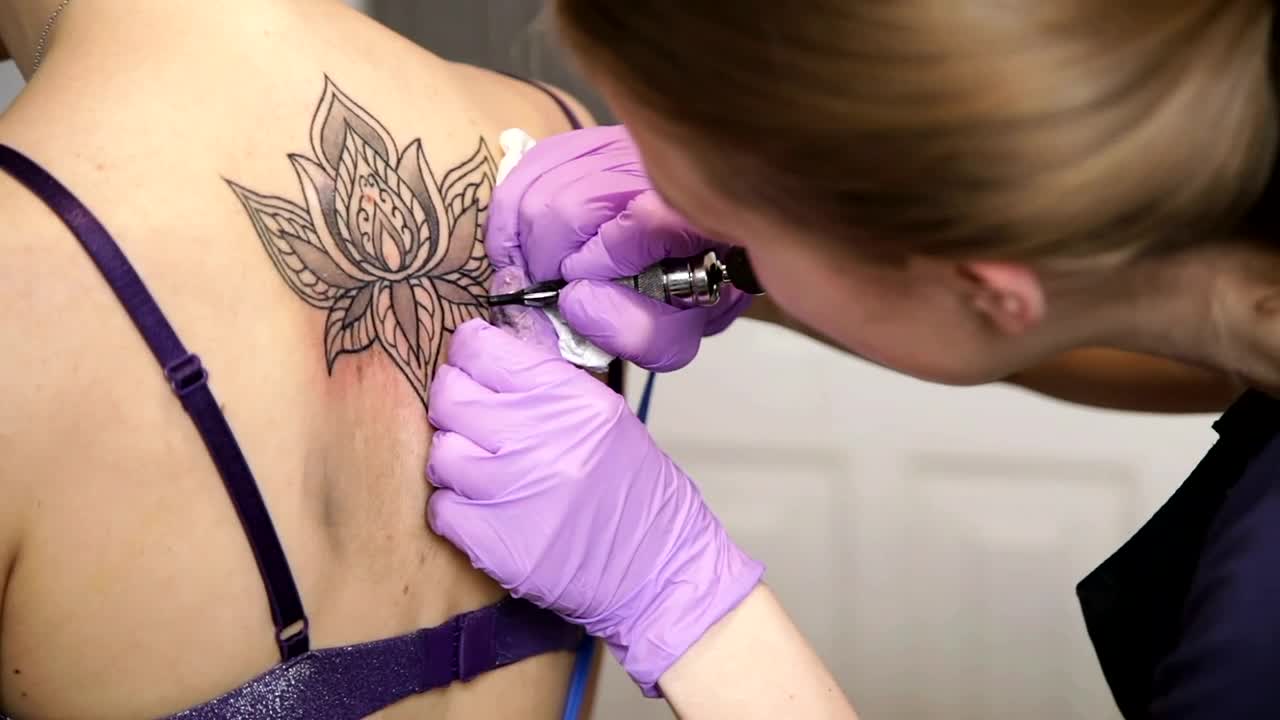 Download Stock Video Applying A Tattoo Live Wallpaper For PC