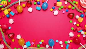 Stock Video Animated Stop Motion Frame Of Candies On A Pink Background Live Wallpaper For PC