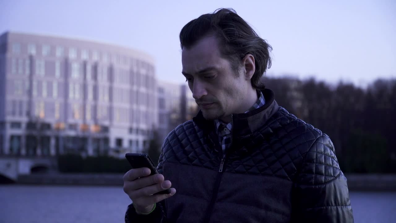 Download Stock Video Angry Man Checking His Smartphone Live Wallpaper For PC