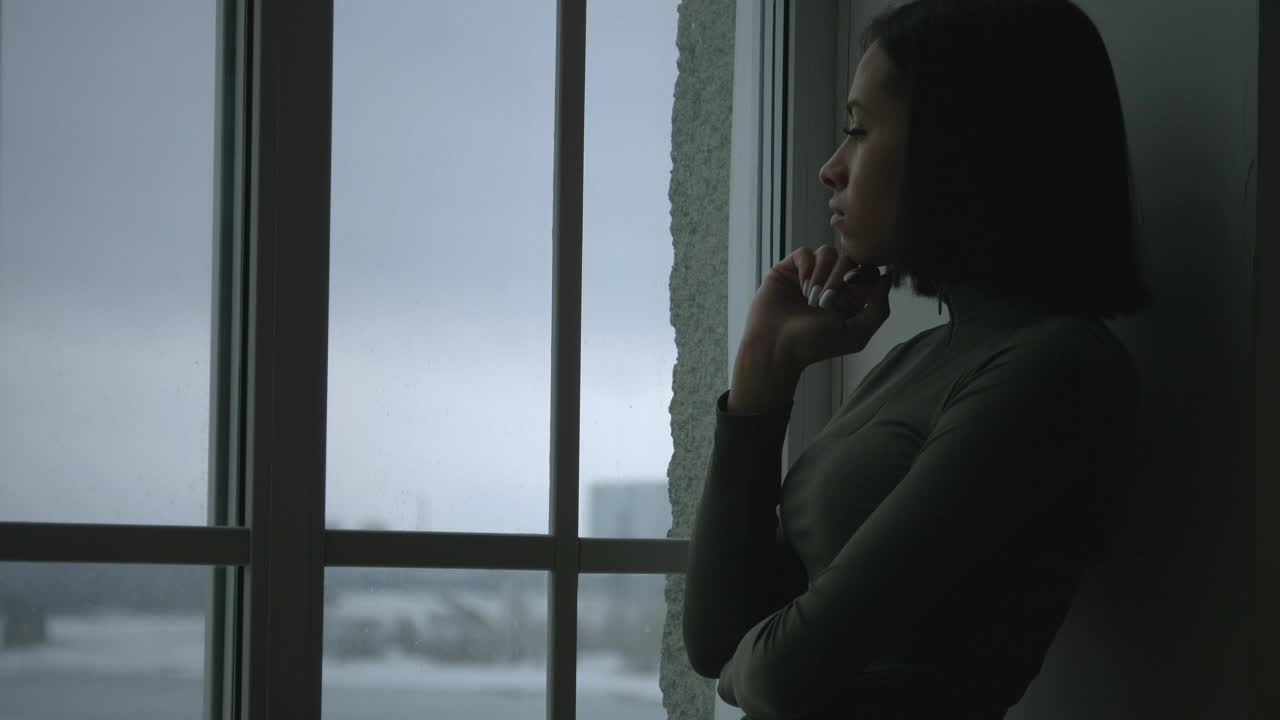 Download Stock Video An Upset Young Woman By The Window Live Wallpaper For PC