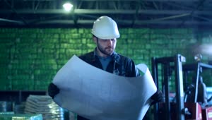 Stock Video An Engineer Working Through The Warehouse Live Wallpaper For PC