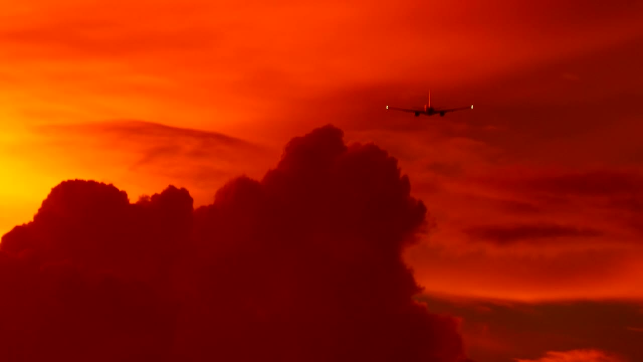 Download Stock Video Airplane Flying In A Red Cloudy Sky Live Wallpaper For PC