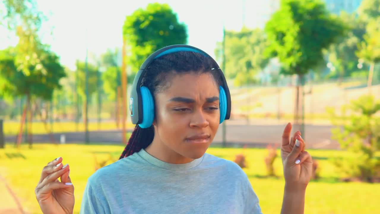 Download Stock Video African American Girl Dancing While Walking In A Park Live Wallpaper For PC